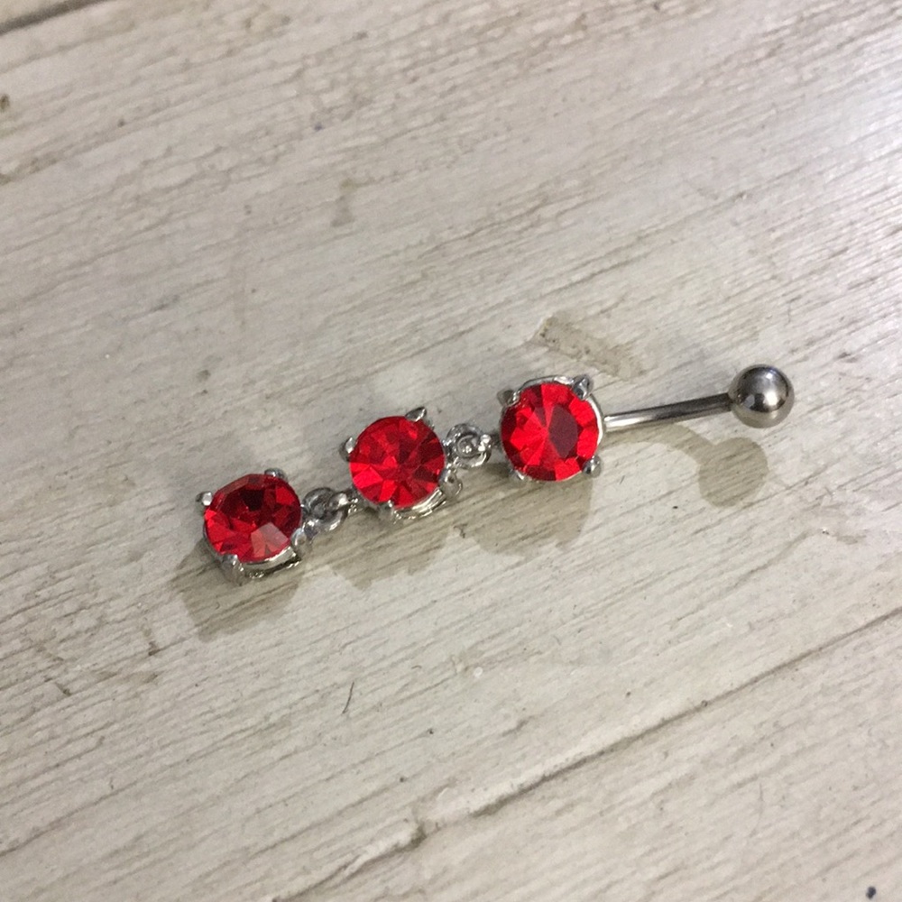 Red dangle belly ring